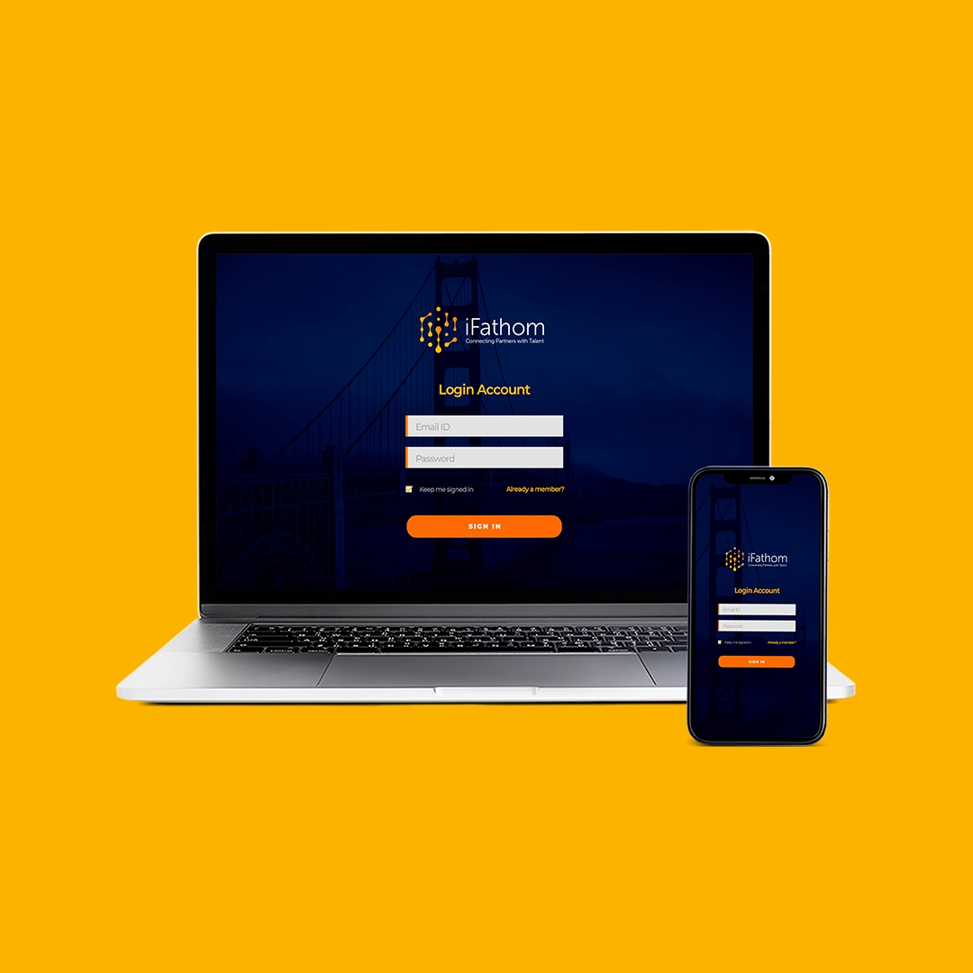 Um notebook junto com um celular, ambos com uma interface de login da empresa IFathom caracteristica pela cor amarela